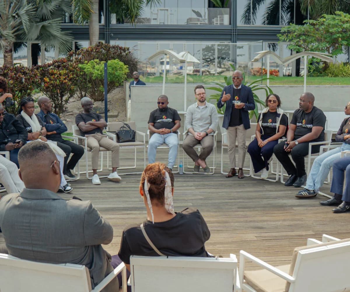 Feerie team in a discussion circle with clients